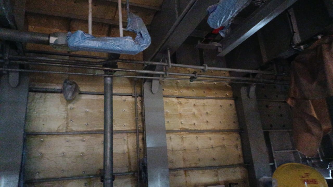 Cover hot water pipe line with Insulation Glass wool termal resistance & alumunium foil Photo